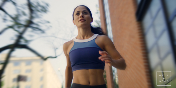 athletic woman running towards camera