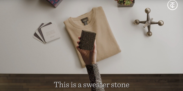 hand holding a square sweater stone above a cream colored sweater. "this is a sweater stone" caption at the bottom
